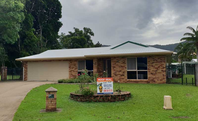 Brick and tile house with reflect roof coating from Roof Seal